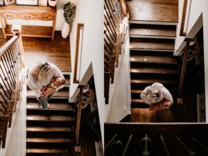 Mom and dad holding their newborn on their couch for family newborn photos.