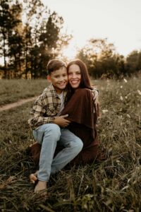Mother and son at cheatham hill park in marietta ga posing for photos.