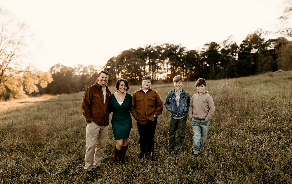 Family having fun during family photos in the sunset.
