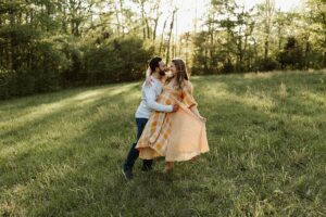 Couple posting for maternity photos in Marietta, Ga