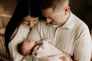 family holding their newborn baby girl